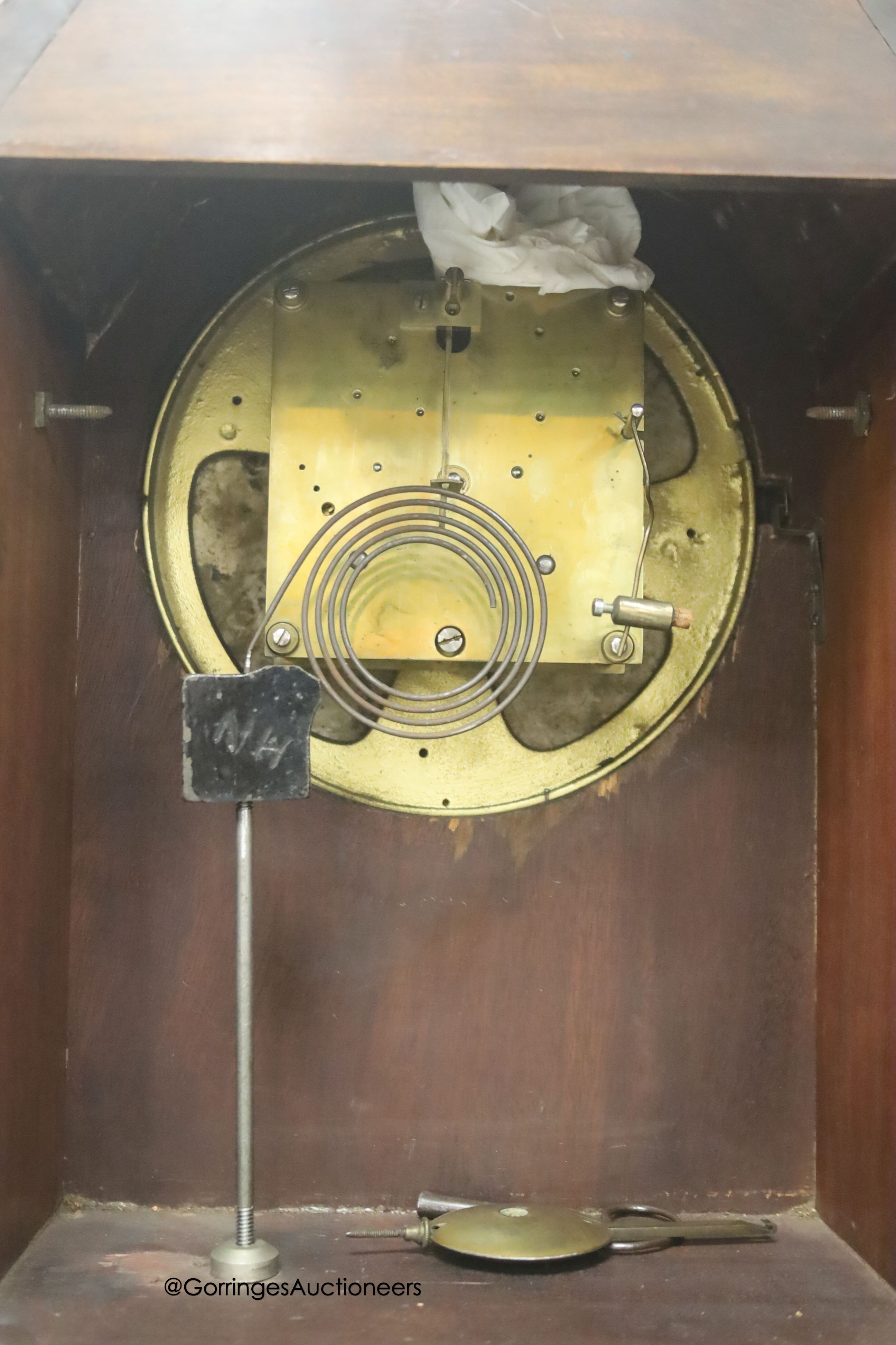 An Edwardian inlaid mahogany mantel clock, with lion mask ring handles, with key and pendulum, height 38cm